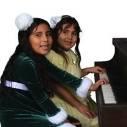 Young girls playing piano